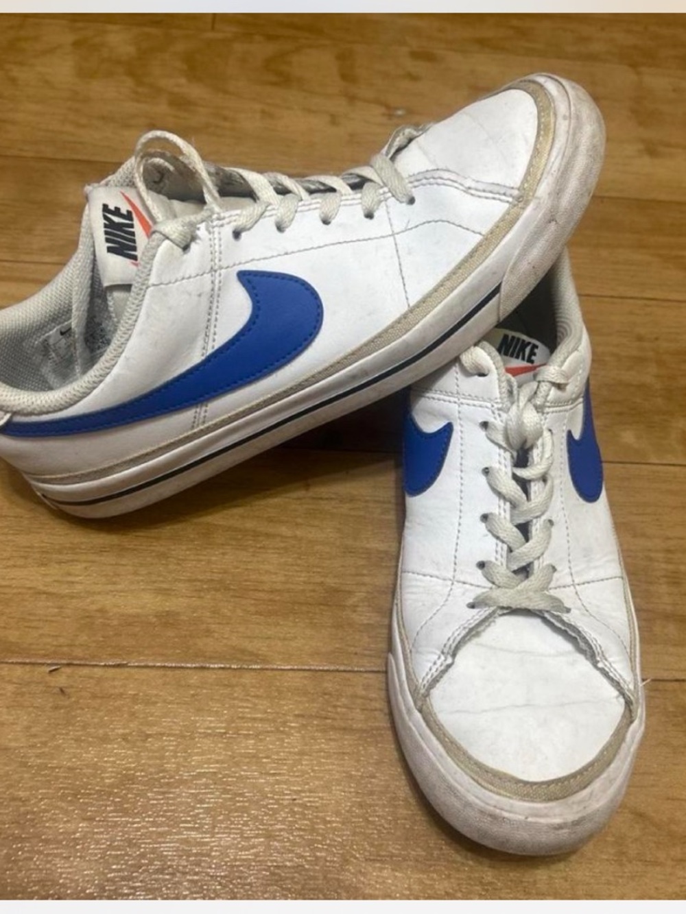 Nike White Leather Low-Top Sneakers with Blue Swoosh - Picture 1 of 6